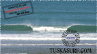 Photo of surf and surfing tubing wave at Widemouth Bay Bude Cornwall UK