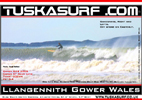 Surf photo of LLangennith with Worms Head back drop
