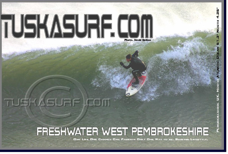 Photo of surf and surfing waves  on Tenby South Beach Pembrokeshire Wales UK